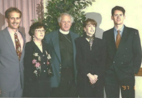 A group of people posing for a photo

Description automatically generated