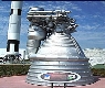 A rocket in a space center

Description automatically generated with medium confidence