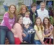 A group of people posing for a photo

AI-generated content may be incorrect.